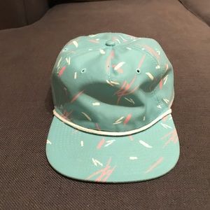 Turquoise sprinkle hat with white piping